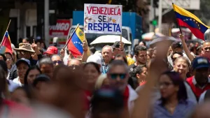 The sign reads, “Respect Venezuela!”, Sept. 5, 2025. Photo: EFE.
