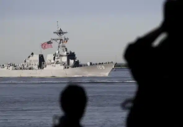 People watch the USS Jason Dunham in 2019. Photo: Drew Angerer/Getty Images/file photo.