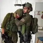 ¨Israeli¨ soldier comforting another soldier. Photo: Ziv Koren/Polaris.
