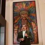 President Nicolas Maduro standing in front of a painting. Photo: Presidential Press.