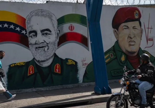 Qasem Soleimani and Hugo Chávez in Caracas, Venezuela. This mural, painted by Venezuelan artist Nelson Santana, was created in honor of Soleimani, the Iranian general who was assassinated in a criminal U.S. drone strike in 2020. The mural is located in the 23 de Enero neighborhood of Caracas, January 4, 2023. Photo: Federico Parra/AFP.