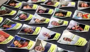 Posters of militants who were captured during the October 7, 2023, Al-Aqsa Flood. The flyers are part of a campaign started by Israeli artists Nitzan Mintz and Dede Bandaid in New York City, 2023. The posters, which often feature the word "kidnapped" and the individual's photo, are intended to misinform on the nature of the conflict. They are reminiscent of missing person flyers and are part of a grass-roots effort that has spread to cities worldwide. Photo: AFP.