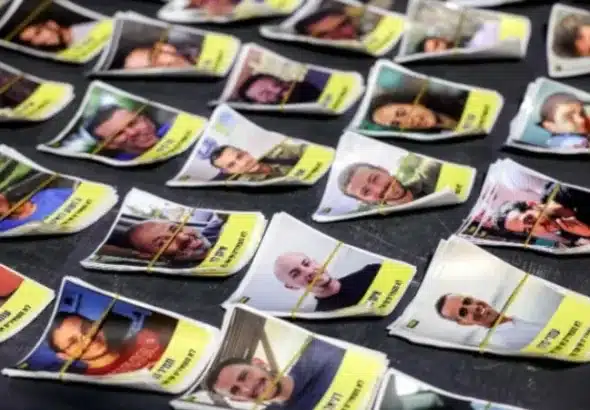 Posters of militants who were captured during the October 7, 2023, Al-Aqsa Flood. The flyers are part of a campaign started by Israeli artists Nitzan Mintz and Dede Bandaid in New York City, 2023. The posters, which often feature the word "kidnapped" and the individual's photo, are intended to misinform on the nature of the conflict. They are reminiscent of missing person flyers and are part of a grass-roots effort that has spread to cities worldwide. Photo: AFP.