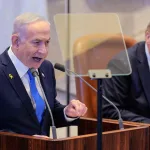the photo captures a moment during a special session of the Knesset, Israel's parliament, where Israeli Prime Minister Benjamin Netanyahu addressed the assembly while former U.S. President Donald Trump was present. The event took place on October 13, 2025, in Jerusalem.