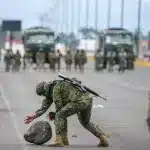 Military removes a stone during protests on Monday, Sep. 20, 2025, in Latacunga, Ecuador. Photo: José Jácome/EFE.