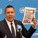 Samuel Moncada, Venezuela’s ambassador to the UN, holds press conference and holds up a picture of front page of T&T Guardian displaying two citizens of Trinidad who were murdered by the last US imperial strike in Caribbean. Photo: X/@elizondogabriel.