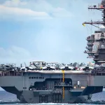 A view of the aircraft carrier USS Gerald R. Ford from aboard the Ticonderoga-class guided-missile cruiser USS Normandy as it participates in a Tactical Force Exercise as part of the Gerald R. Ford Carrier Strike Group, Oct. 13, 2022. Photo: MCS 2nd Class Malachi Lakey/US Navy/File photo.