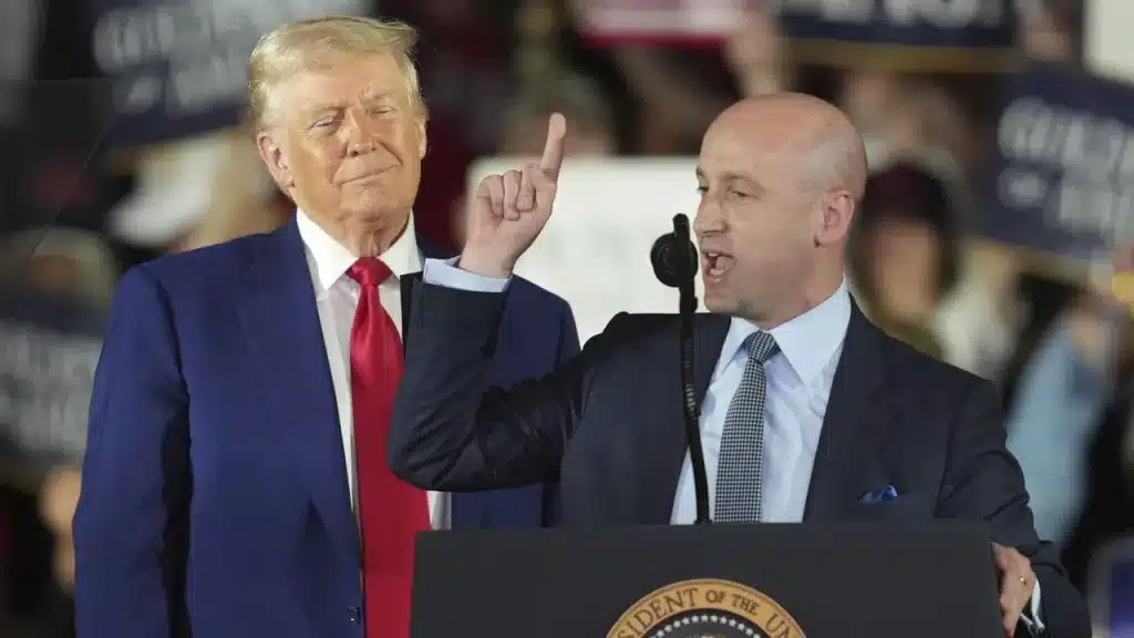 US President Donald Trump listens while White House Deputy Chief of Staff Stephen Miller speaks in Warren, Michigan, April 29, 2025. Photo: AP/Paul Sancya.