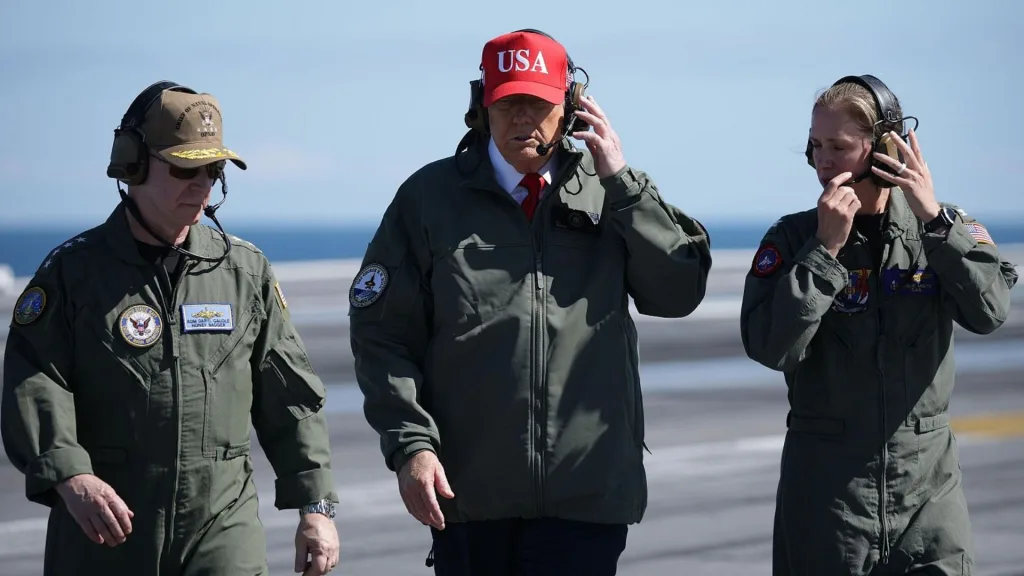 US President Donald Trump (center) aboard the US naval ship USS George HW Bush, Norfolk, Virginia, October 5, 2025. Photo: Alex Wong/Reuters.