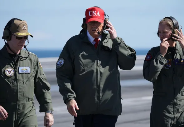 US President Donald Trump (center) aboard the US naval ship USS George HW Bush, Norfolk, Virginia, October 5, 2025. Photo: Alex Wong/Reuters.