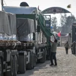 Aid trucks enter Gaza. Photo: Eyad Baba/AFP.