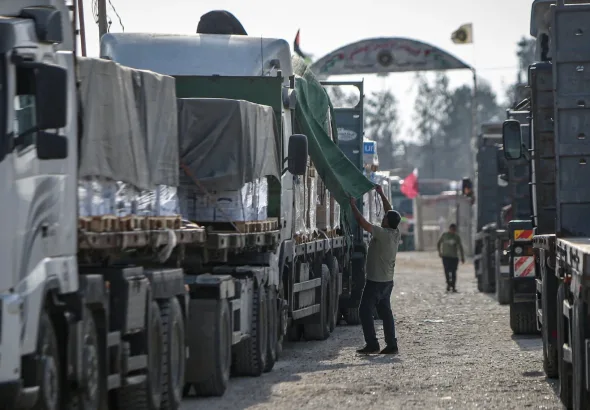 Aid trucks enter Gaza. Photo: Eyad Baba/AFP.