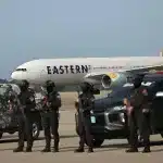 Venezuelan law enforcement agents guarding the landing site of a US Eastern Airlines flight carrying Venezuelan repatriated migrants from the US on October 1, 2025. Photo: IG/@minjusticia_ve.