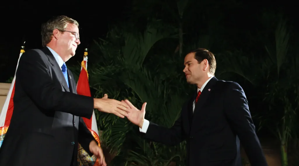 Jeb Bush (left) and Marco Rubio (right) shake hands during a Florida fundraising in 2015. Photo: Joe Raedle/Getty Images/File photo.