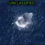 Screenshot of a video released by the US War Secretary, appearing to show the moment a small boat was hit by a US extrajudicial killing in the Caribbean on November 1, 2025. Photo: X/@SecWar.