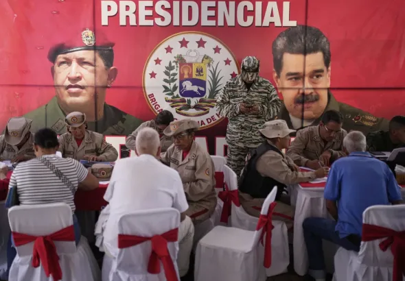 Answering the call of the government of President Nicolás Maduro, people sign up to join Venezuela's civil militias at a square in Caracas, the capital, on Aug. 23, 2025. Photo: Ariana Cubillos/AP Photo.