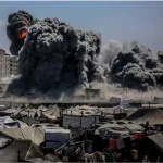 Smoke rises from the Harmony Tower, a residential complex in western Gaza City bombed by Zionist forces. Photo: X/@QudsNen.