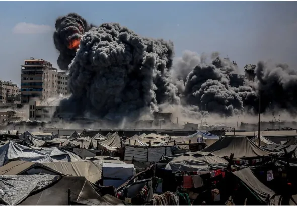 Smoke rises from the Harmony Tower, a residential complex in western Gaza City bombed by Zionist forces. Photo: X/@QudsNen.