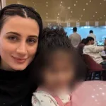 Teuta ‘T’ Hoxha pictured with her godchild. Photo: T Hoxha.