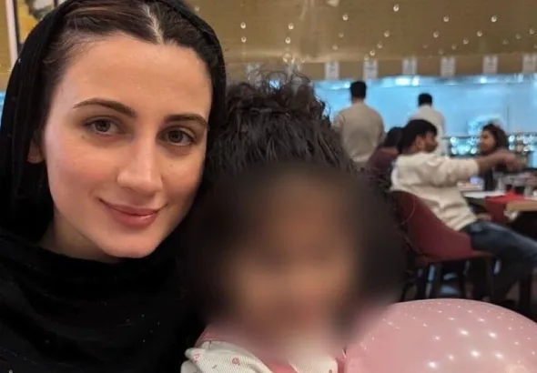 Teuta ‘T’ Hoxha pictured with her godchild. Photo: T Hoxha.