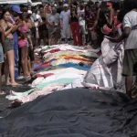 Family members of victims of Rio de Janeiro police operation search for their loved ones. Photo: Screenshot.