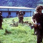 Members of the US 82nd Airborne Division prepare to go out on patrol during Operation Urgent Fury in Grenada, 1982. Two soldiers have M203 40 mm grenade launchers mounted on M16A1 rifles. Photo: Wikimedia Commons.