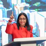 Vice president of Venezuela, Delcy Rodríguez, speaking at the Simposio Mundial de los Barrios (World Symposium of Neighborhoods) in Caracas. Source: Venezuela's office of the vice president. 