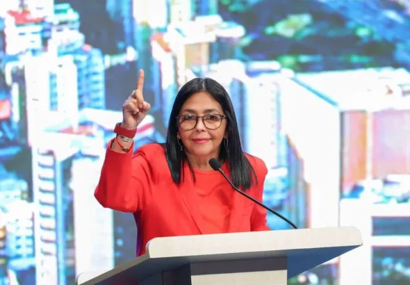Vice president of Venezuela, Delcy Rodríguez, speaking at the Simposio Mundial de los Barrios (World Symposium of Neighborhoods) in Caracas. Source: Venezuela's office of the vice president. 