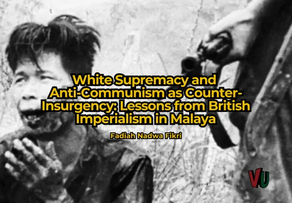 A wounded man is held at gunpoint by British forces in Malaya. Photo: Ministry of Information.