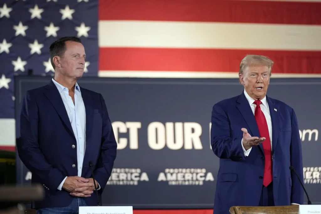 Richard Grenell (left) standing beside Donald Trump (right) at a 2024 campaign event. Photo: AP/Alex Brandon.