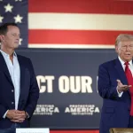 Richard Grenell (left) standing beside Donald Trump (right) at a 2024 campaign event. Photo: AP/Alex Brandon.