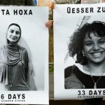 The image shows posters of Teuta Hoxha and Qesser Zurah (also spelled Qesser Zuhrah), who are activists affiliated with Palestine Action and have been on a prolonged hunger strike in UK prison. Photo: The Bristol Cable/file photo.