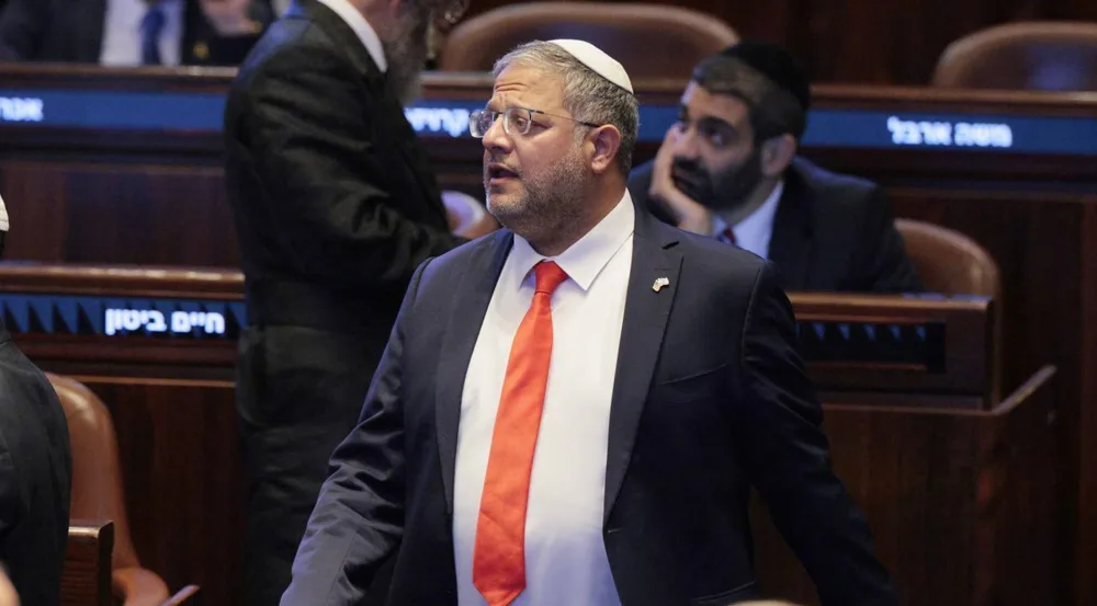 Israel's far-right minister Itamar Ben Gvir stands at the Knesset (parliament) in occupied al-Quds on October 13, 2025. Photo: AFP.