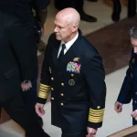 US Navy Admiral Frank ‘Mitch’ Bradley (centre) commander of the US Special Operations Command, and General Dan Caine, chairman of the Joint Chiefs of Staff (right) are escorted to a classified briefing, Dececmber 4, 2025. Photo: J. Scott Applewhite/AP.