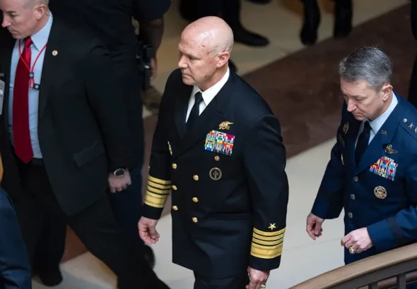 US Navy Admiral Frank ‘Mitch’ Bradley (centre) commander of the US Special Operations Command, and General Dan Caine, chairman of the Joint Chiefs of Staff (right) are escorted to a classified briefing, Dececmber 4, 2025. Photo: J. Scott Applewhite/AP.