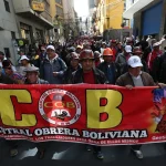 Members of the Bolivian Workers' Central (COB) marching through the streets of La Paz, Bolivia. Photo: EFE/Martin Alipaz.