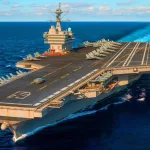 USS Gerald R. Ford, the world's largest and most advanced aircraft carrier, is now deployed in the Caribbean. Photo: Energy Reporters.