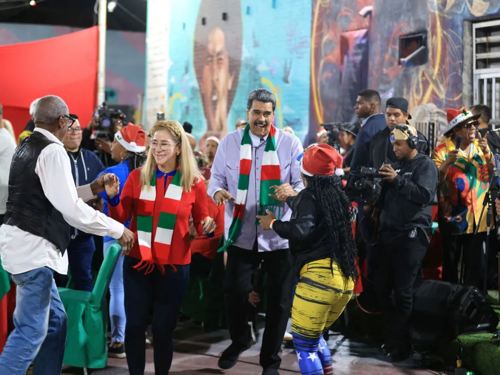 Venezuelan President Nicolás Maduro dancing during a Christmas dinner in a working class barrio of Caracas on December 23, 2025. Photo: Reuters.
