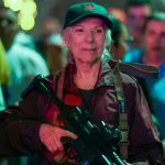 A woman holds a rifle during a security deployment in the Petare neighbourhood of Caracas, Venezuela, 15 October 2025. Photo: Rosana Silva R./file photo.