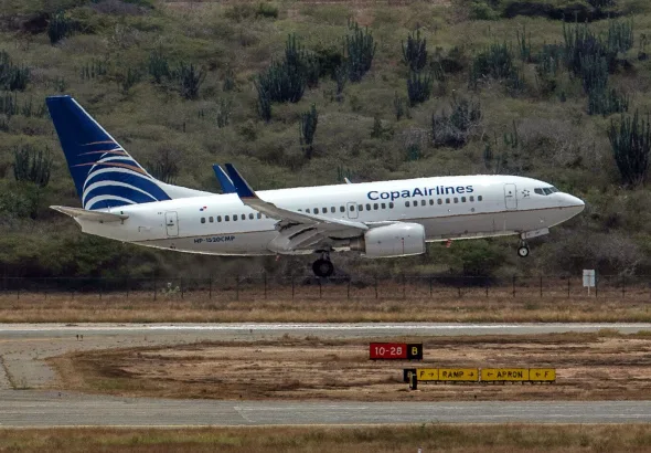 A Copa Airlines plane lands at Simón Bolívar International Airport in Maiquetía, La Guaira state, Venezuela. Photo: Carlos Becerra/Bloomberg/File photo.