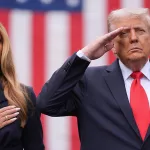 US First Lady Melania Trump and US President Donald Trump standing beside each other. Photo: AP/Evan Vucci.