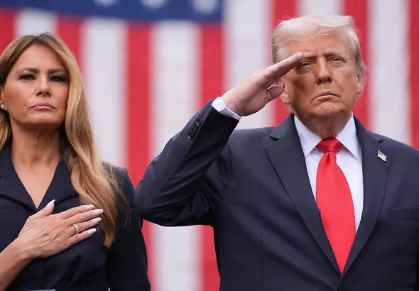 US First Lady Melania Trump and US President Donald Trump standing beside each other. Photo: AP/Evan Vucci.