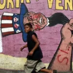 A 2007 mural in Caracas depicting "Uncle Sam," the figurative snake of imperialism. Photo: Mario Tama.