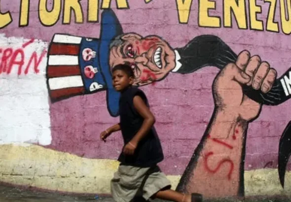 A 2007 mural in Caracas depicting "Uncle Sam," the figurative snake of imperialism. Photo: Mario Tama.