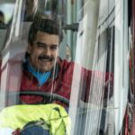 Venezuelan President Nicolas Maduro drives a bus while leaving the airport after arriving in Caracas, Venezuela, Jan. 17, 2015. Photo: AFP/file photo.