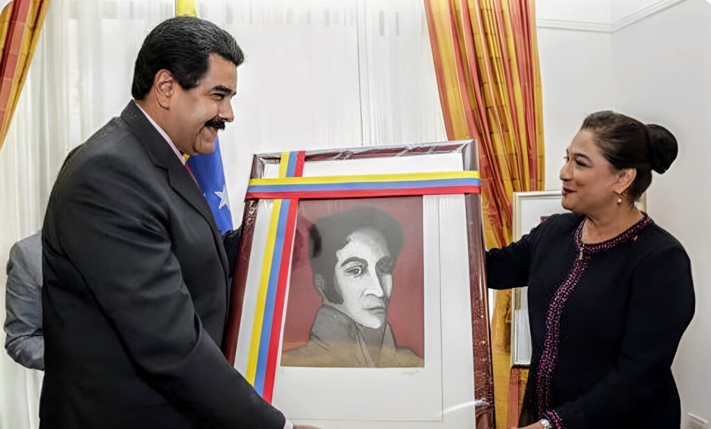 Then-Prime Minister of Trinidad and Tobago, Kamla Persad-Bissessar, received a portrait of Simón Bolívar from the President of Venezuela, Nicolás Maduro in 2015. Photo: Wired 868/file photo.