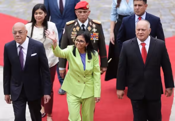 Venezuelan Acting President Delcy Rodríguez enters the National Assembly, escorted by its President Jorge Rodríguez and Interior Minister Diosdado Cabello, to deliver the annual message to the nation on Thursday, January 15, 2026. Photo: Ronald Peña R./EFE.