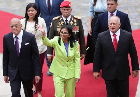 Venezuelan Acting President Delcy Rodríguez enters the National Assembly, escorted by its President Jorge Rodríguez and Interior Minister Diosdado Cabello, to deliver the annual message to the nation on Thursday, January 15, 2026. Photo: Ronald Peña R./EFE.