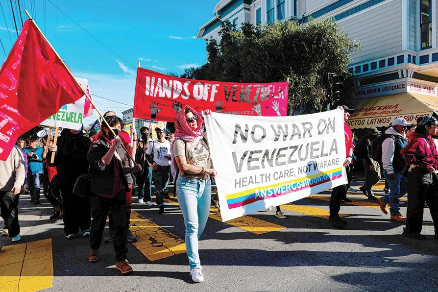 Marchers protest during the San Francisco Fight Trump's War on Venezuela in the Mission district of San Francisco on Saturday, January 10, 2026. Photo: Yalonda M James/San Francisco Chronicle via AP.