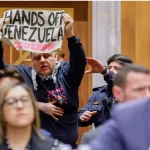 Brave protestor decries US war crimes at Senate hearing. Photo: RT.